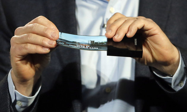 A prototype Windows smartphone with a flexible OLED display is seen during Samsung's keynote address at the International Consumer Electronics Show in Las Vegas, Wednesday, Jan. 9, 2013. (AP Photo/Jae C. Hong)