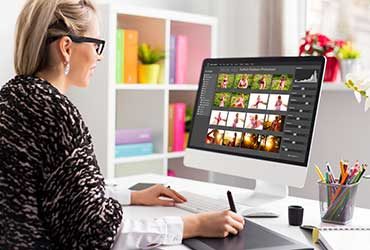 woman arranging images on computer